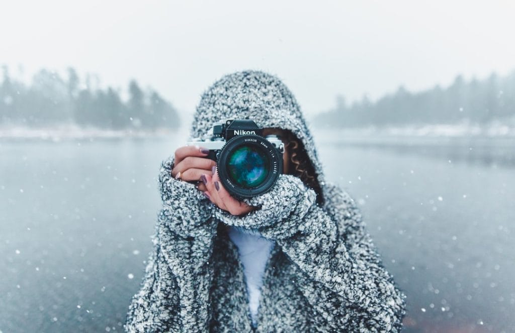 ConvertKit Review 1 woman using Nikon DSLR camera